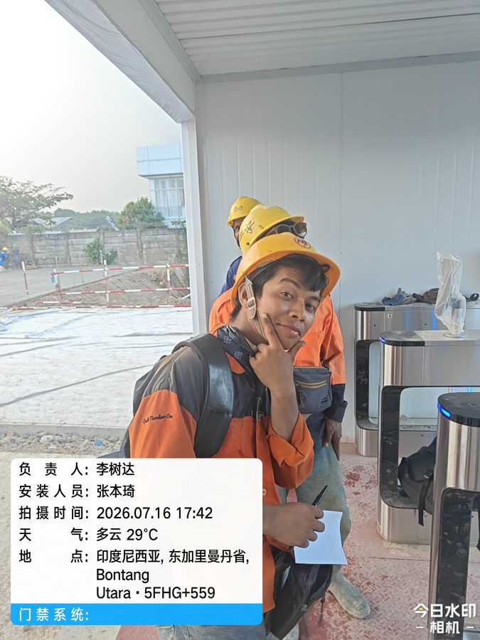 Worker passing a face recognition turnstile at the project gate