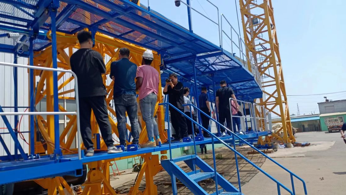 Client and engineers on the crane platform walkway checking equipment layout and the operator sightline